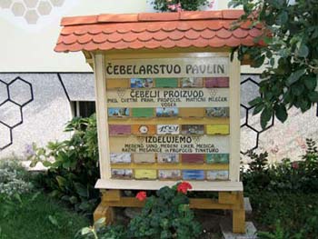 The Pavlin family tending to traditional Slovenian beehives
